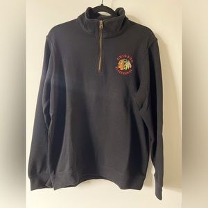 Chicago Blackhawks NHL Black 3/4 zip sweater.